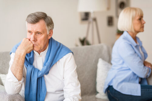 older adults sitting on the couch gray divorce