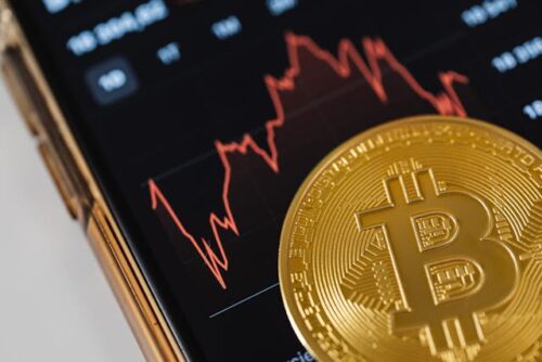 bitcoin and phone with stocks