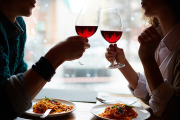 two people on a date with wine and pasta