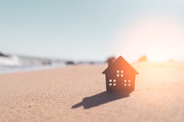 miniature house on a beach