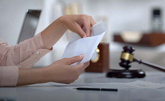 woman taking money out of an envelope