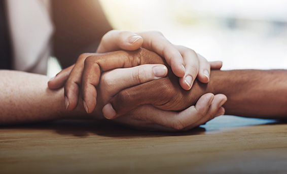 two people holding hands